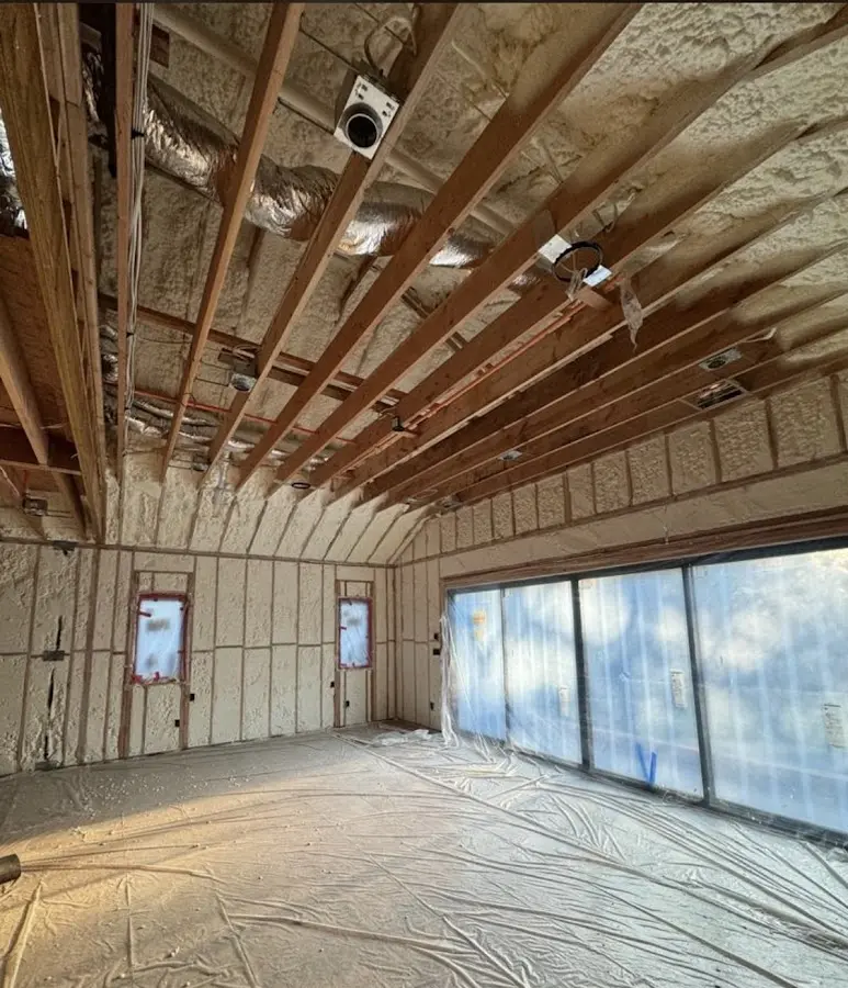 Interior walls and ceiling insulated with spray foam during new construction in Kingstowne